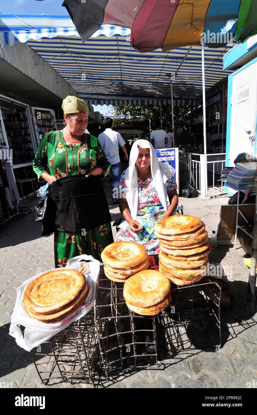 Obi Non- a traditional Uzbek / Tajik bread sold at the market in Bukhara, Uzbekistan. Stock Photo