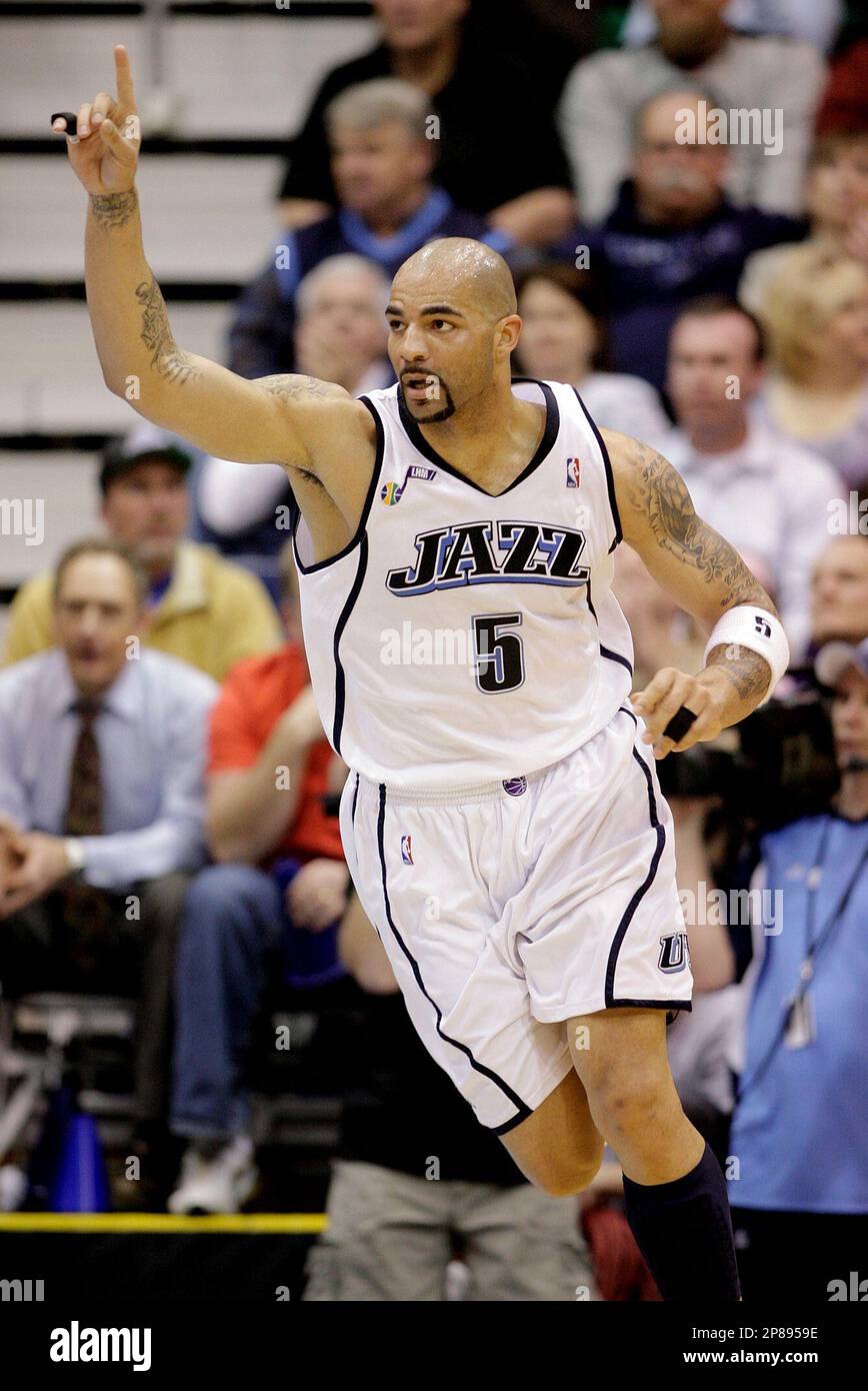 FILE - In this March 30, 2009, file photo, Utah Jazz forward Carlos Boozer  celebrates a basket during an NBA basketball game against the New York  Knicks in Salt Lake City. Boozer