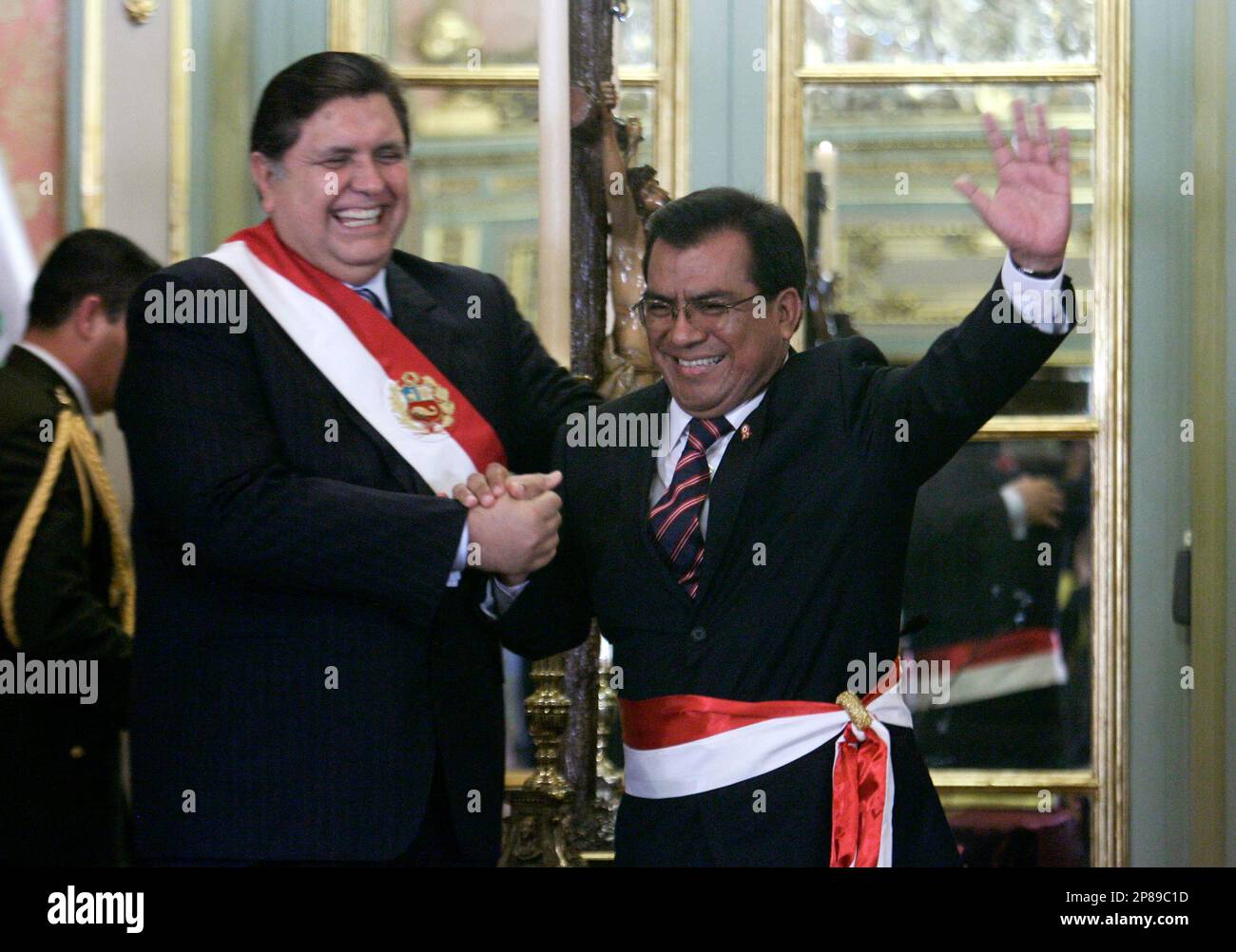 Mexico's actor Roberto Gomez Bolanos, left, reads a poem as his wife  Florinda Meza gestures a ceremony in Bolano's honor in Peru's Congress in  Lima, Friday, July 4, 2008. (AP Photo/Karel Navarro