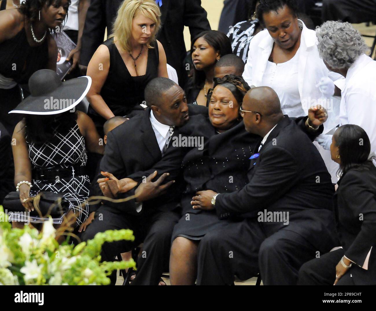 Lucille McNair, seated center, mother of Steve McNair, is consoled by family  and friends during the funeral service for Steve McNair in Hattiesburg,  Miss., Saturday, July 11, 2009. McNair, a former NFL