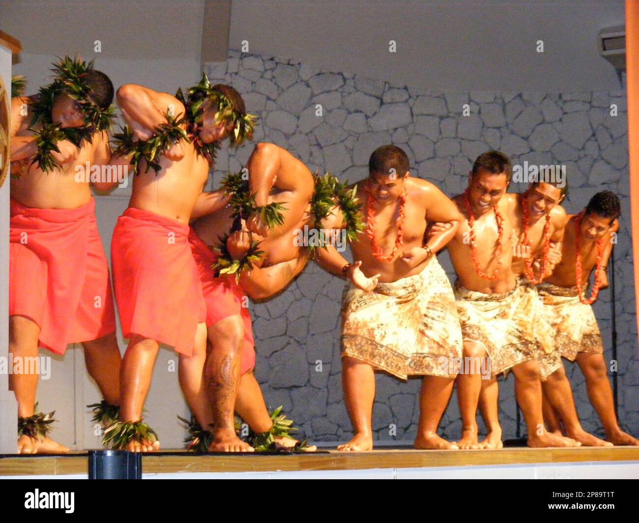 Dancers representing Hawaii, red, and the Samoas join to form a link at