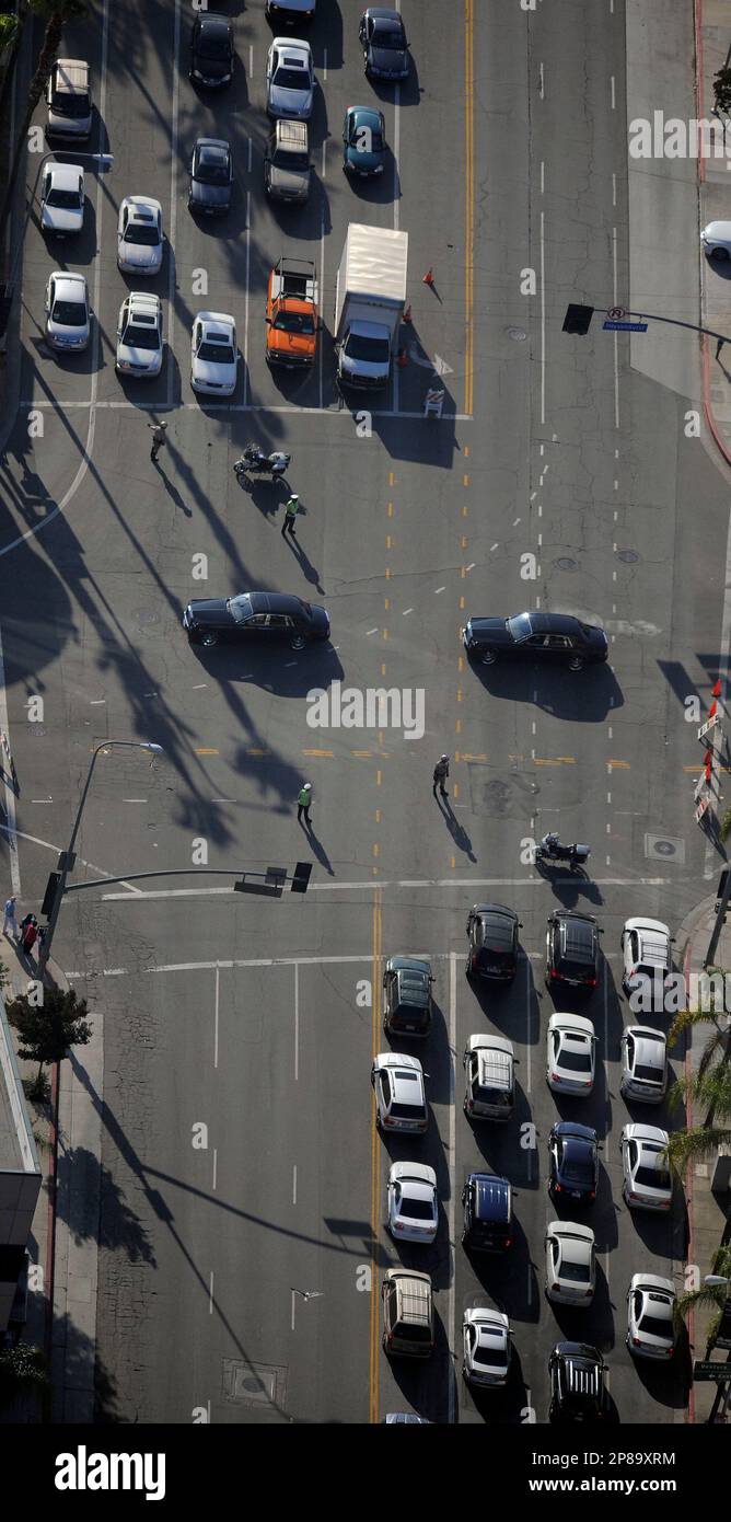 A motorcade leaves the late pop star Michael Jacksons' family home in