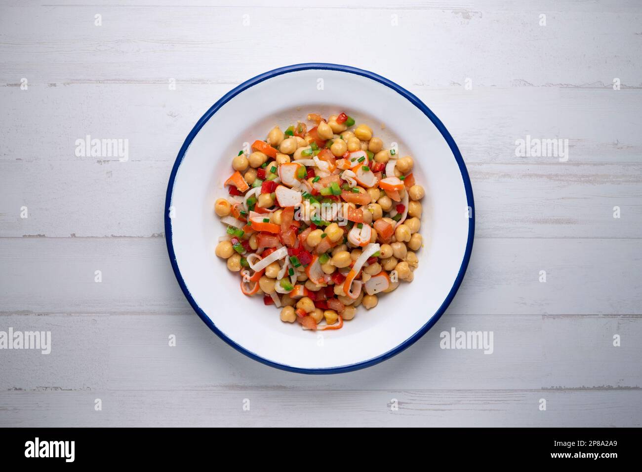 Delicious and healthy chickpea salad with crab surimi. Stock Photo