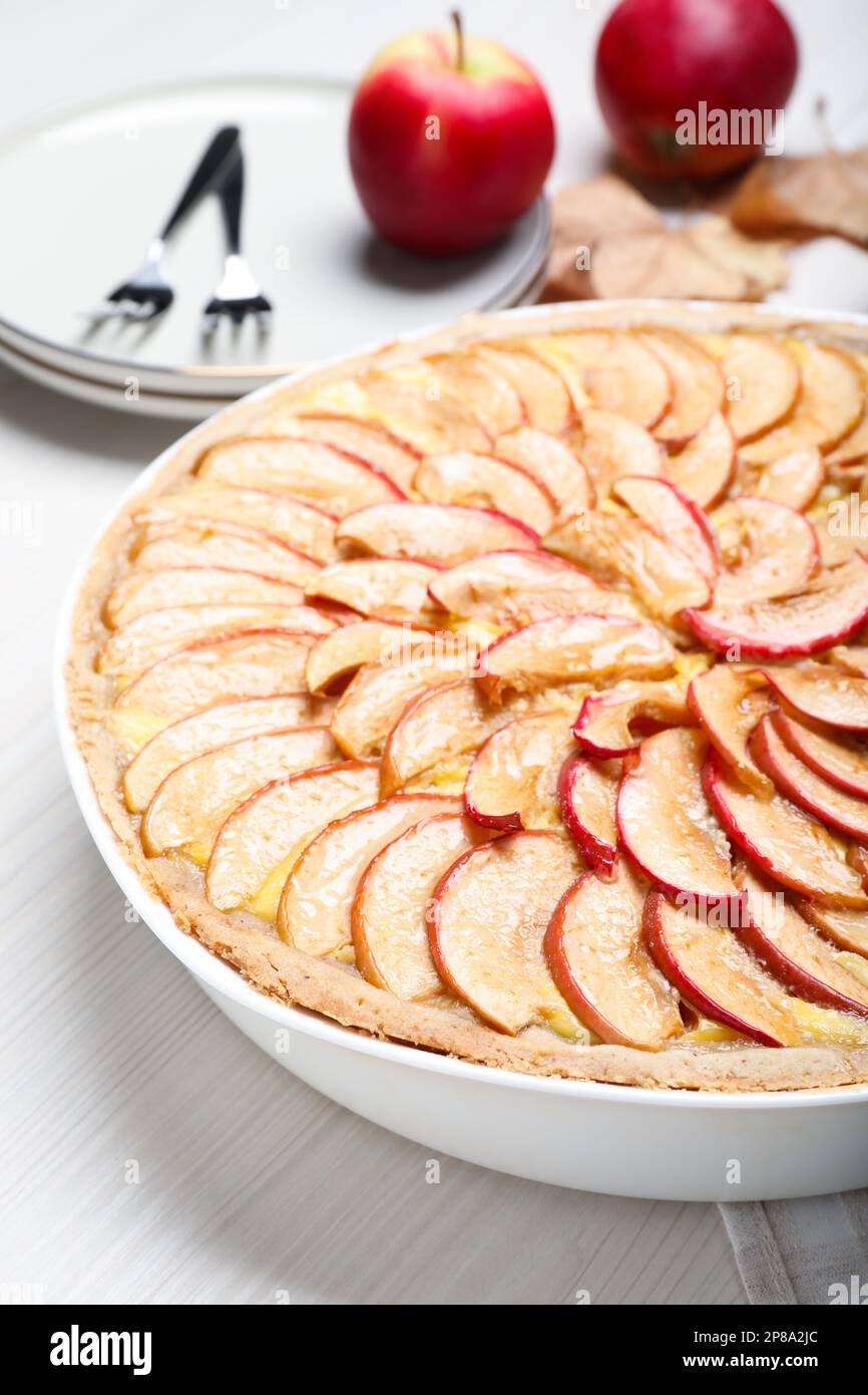 Tasty apple pie on white wooden table, closeup Stock Photo