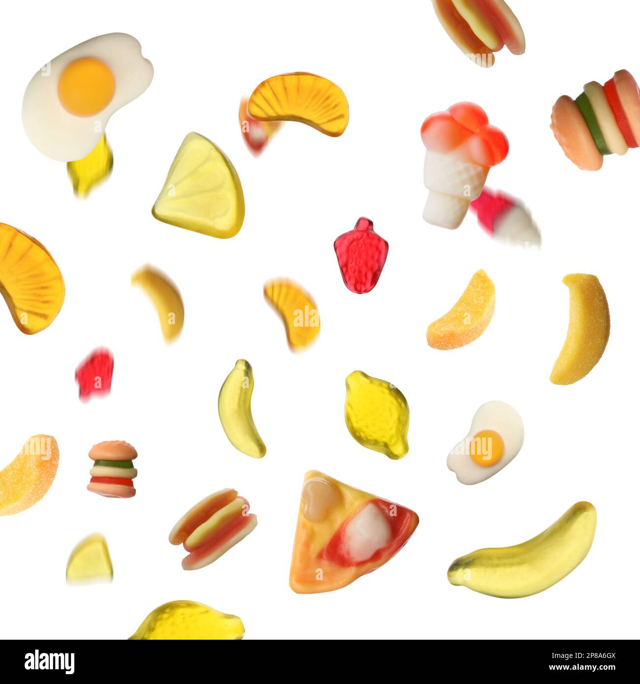 Tasty jelly candies falling on white background Stock Photo - Alamy