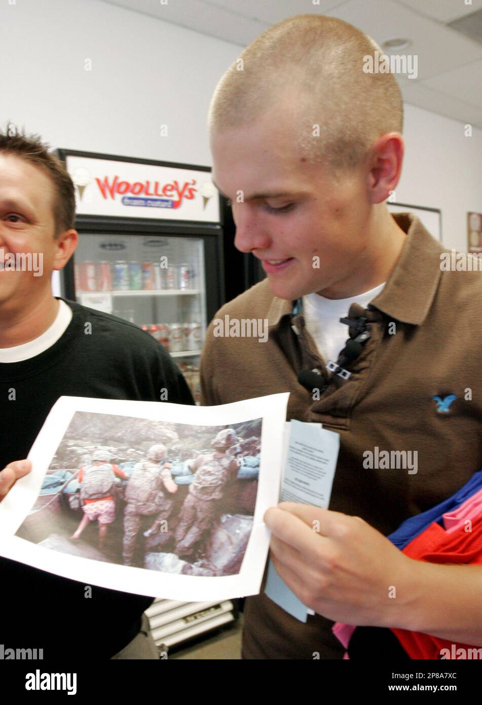 U.S. Army Specialist Zachary Boyd looks at a photo of himself at