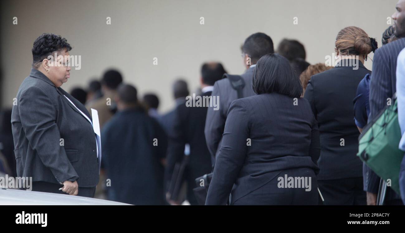 Evon Ward, of Maywood, Ill. pauses before joining a line of Job seekers