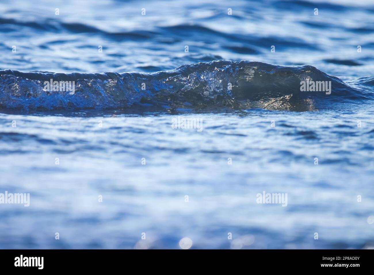 Ocean wave splashing on the beach. Sea wave Stock Photo - Alamy