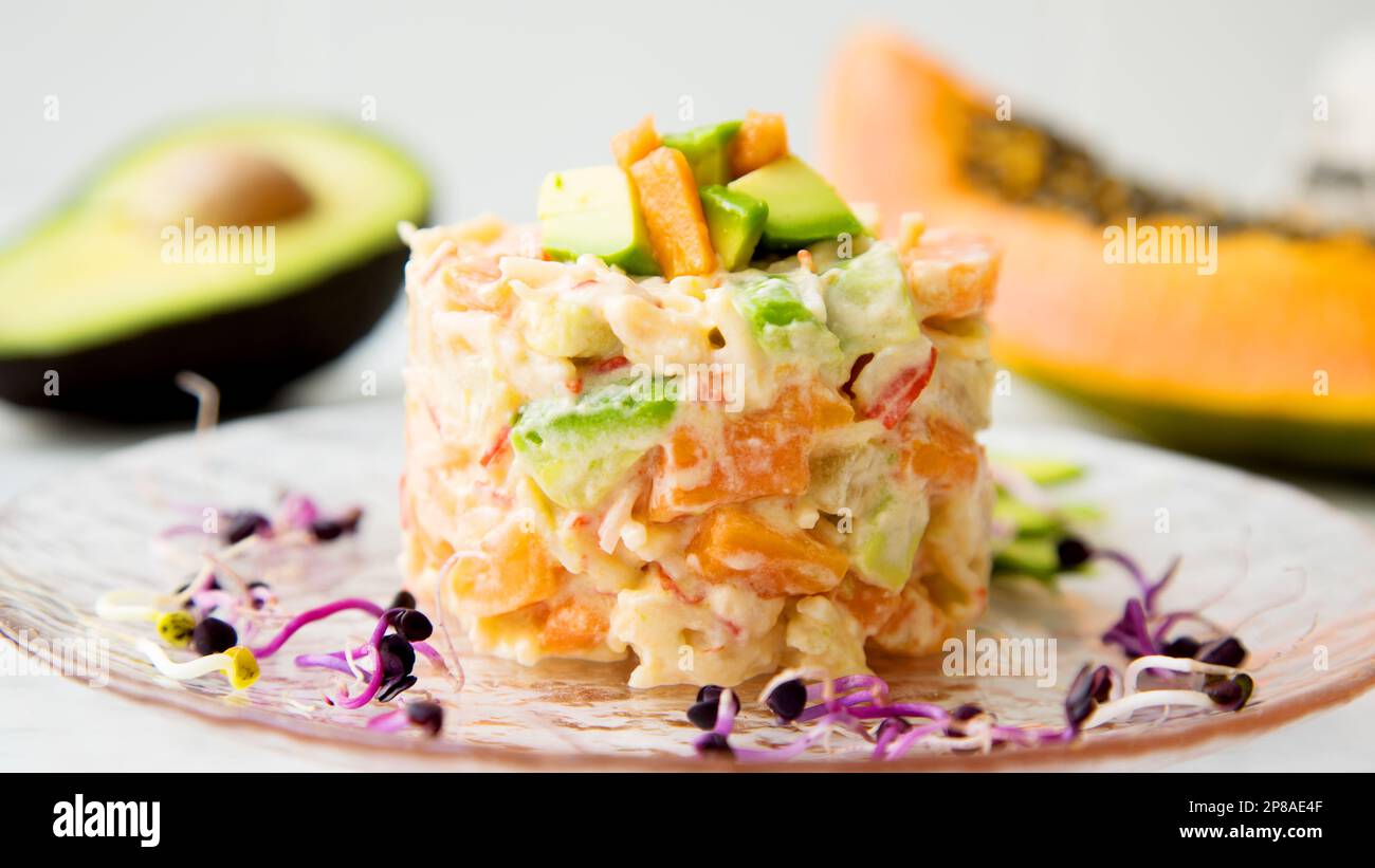 Delicious salad with mayonnaise, avocado and carrot. Stock Photo