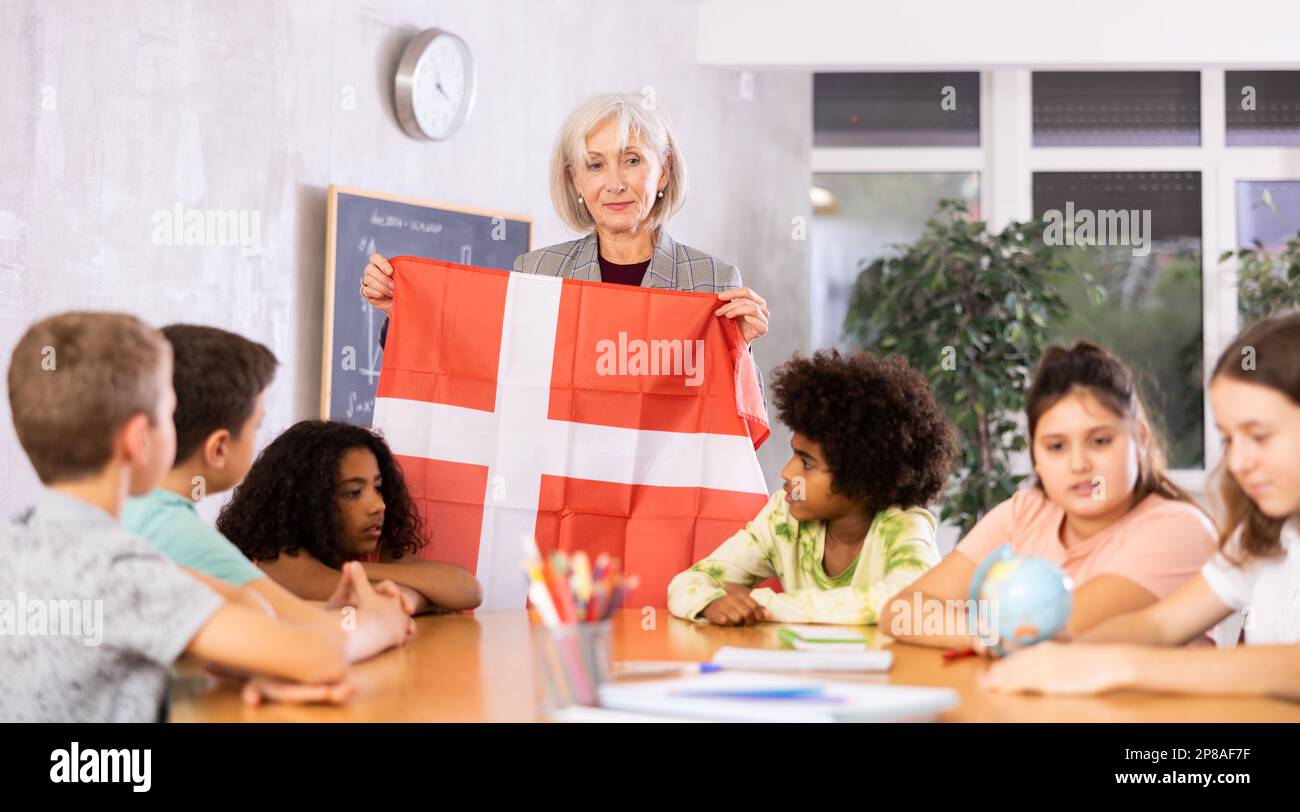 students listen to the teacher who talks about Denmark Stock Photo