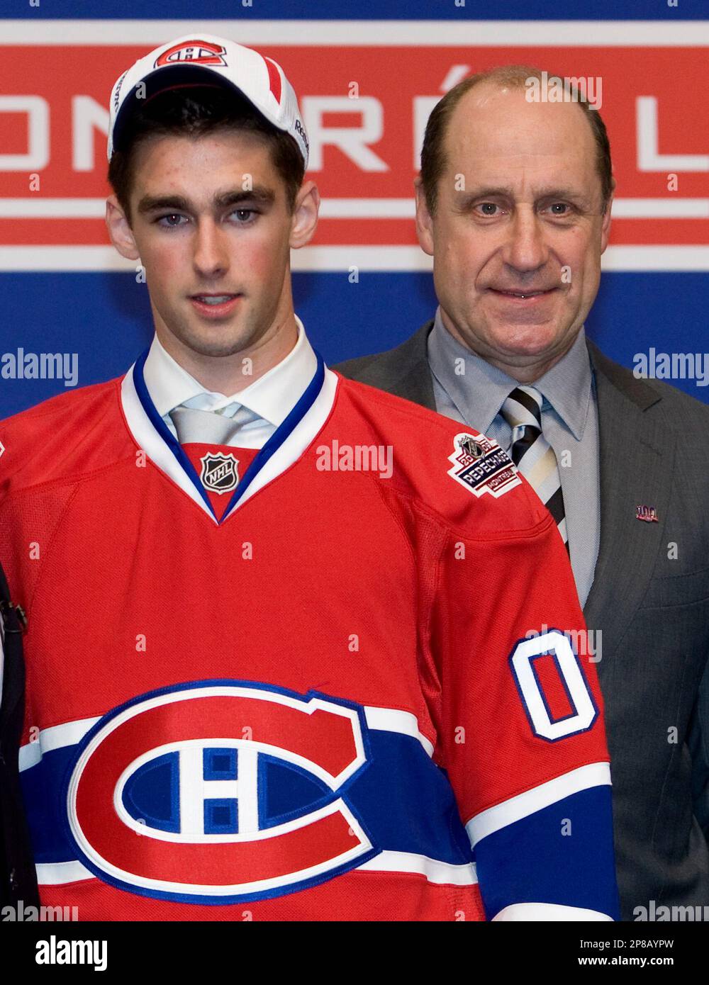 Montreal Canadiens draft pick Louis Leblanc poses for a photo with general manager Bob Gainey at the 2009 NHL hockey entry draft Friday, June 26, 2009, in Montreal
