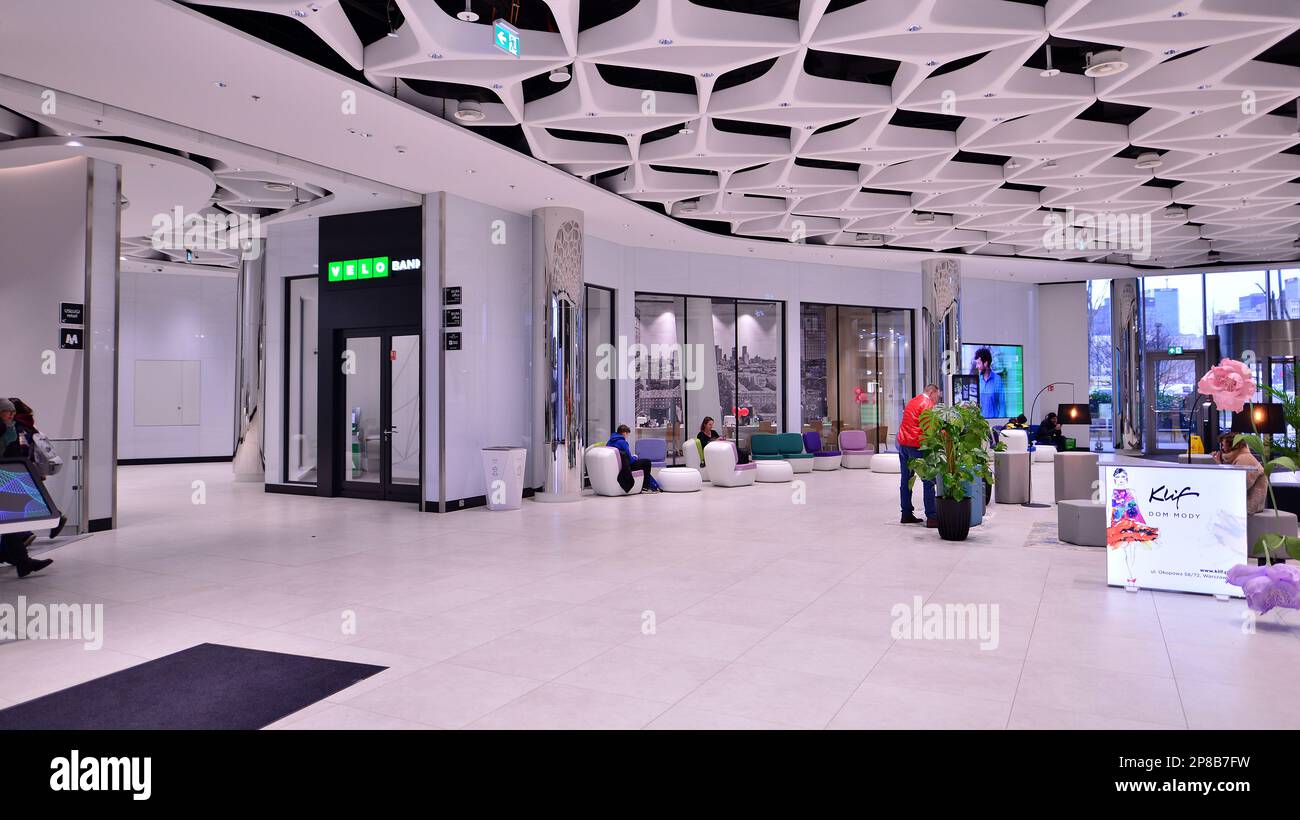 Warsaw, Poland. 8 March 2023. People walking in a shopping mall past