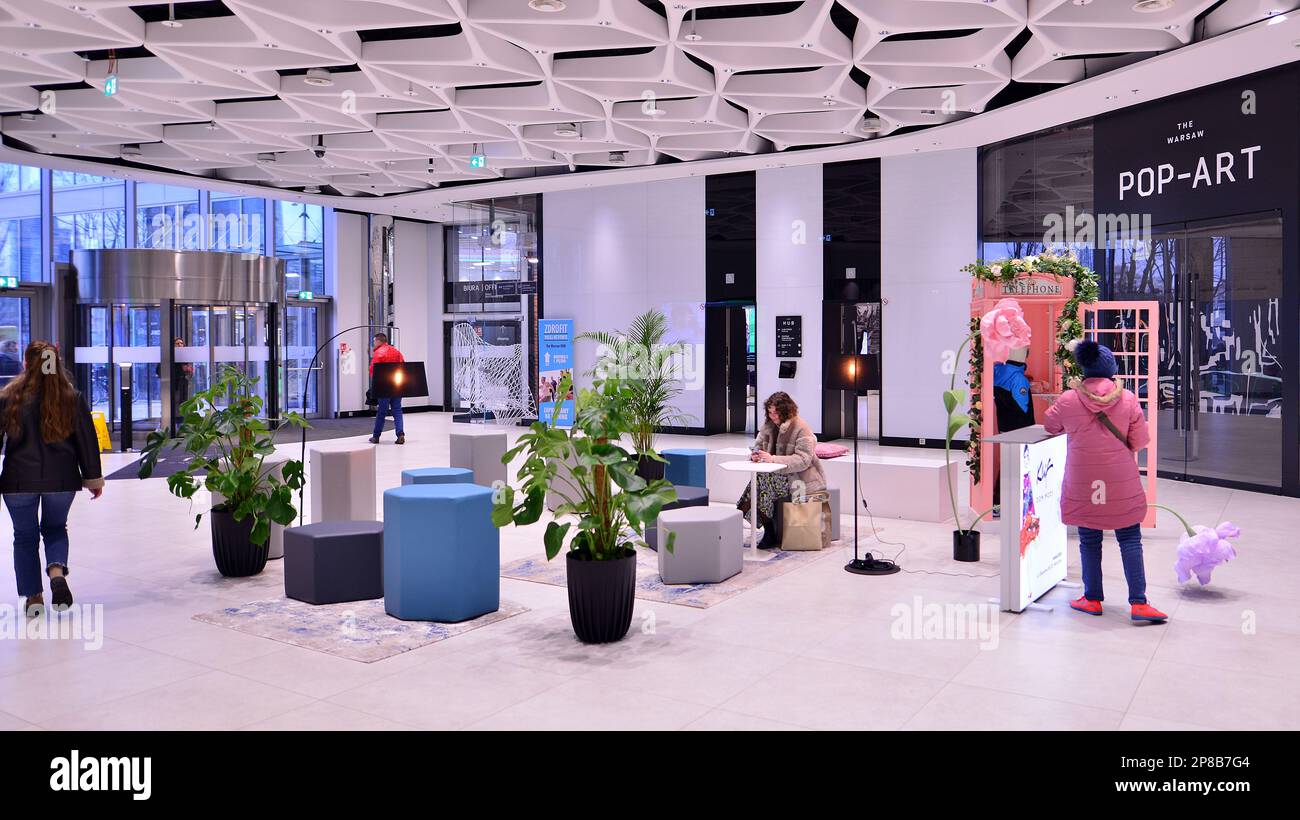 Warsaw, Poland. 8 March 2023. People walking in a shopping mall past