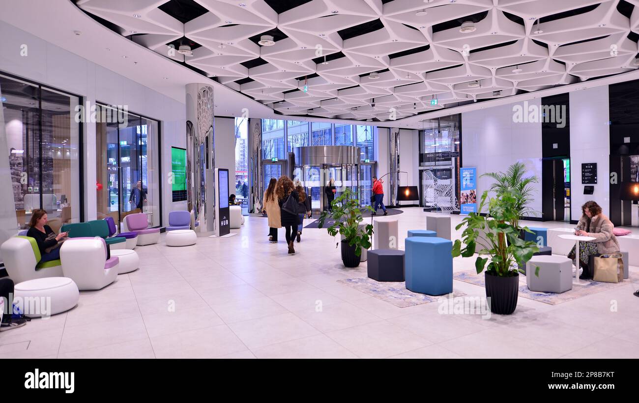 Warsaw, Poland. 8 March 2023. People walking in a shopping mall past