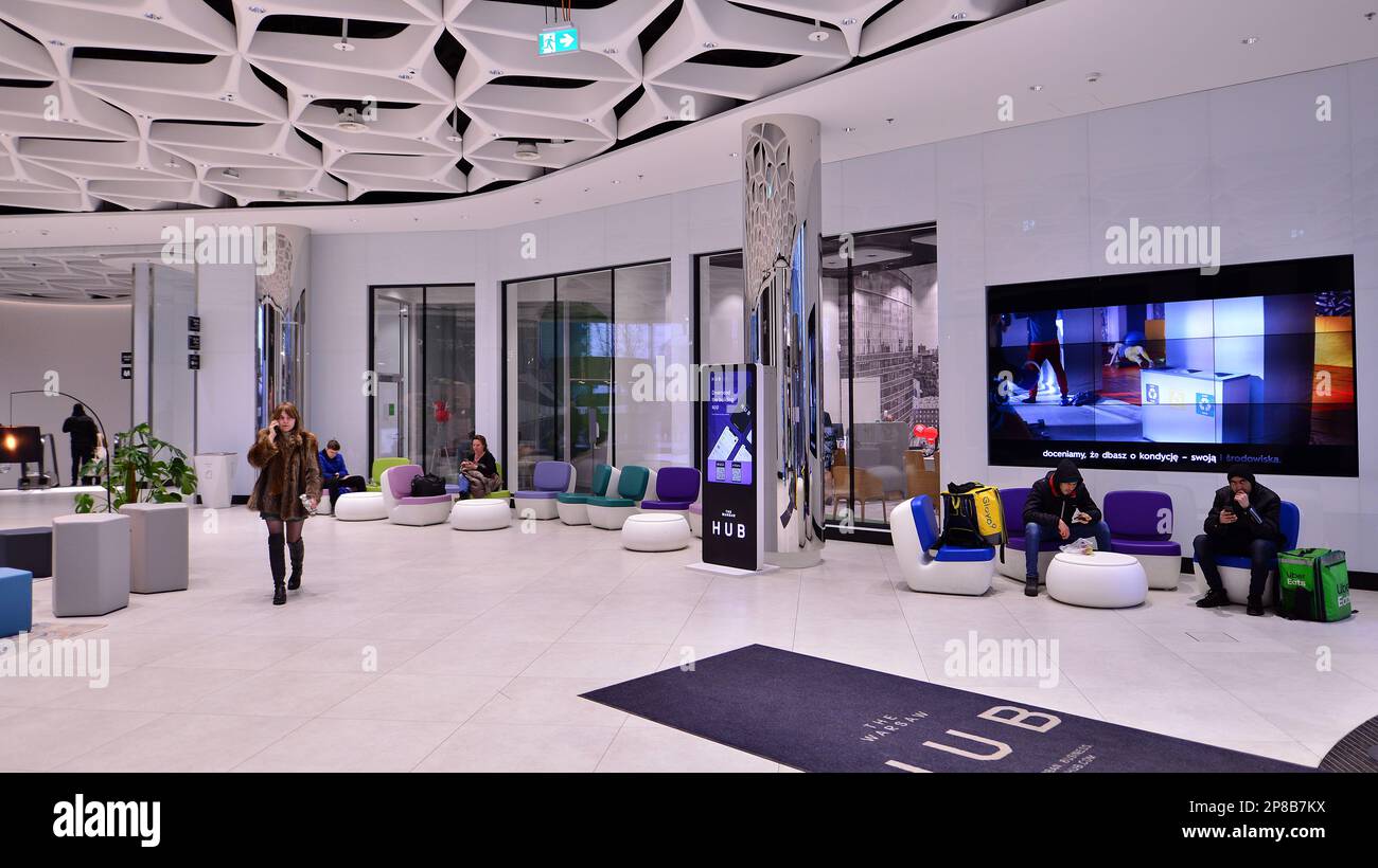 Warsaw, Poland. 8 March 2023. People walking in a shopping mall past