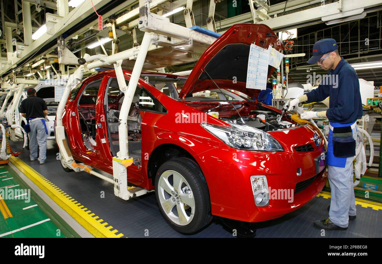 In this photo taken on June 5, 2009, Toyota workers assemble parts on ...