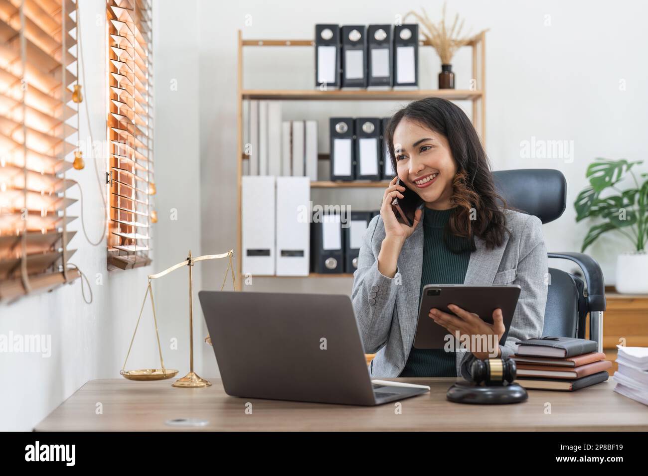 Female lawyer works in office or court, checks clients contracts