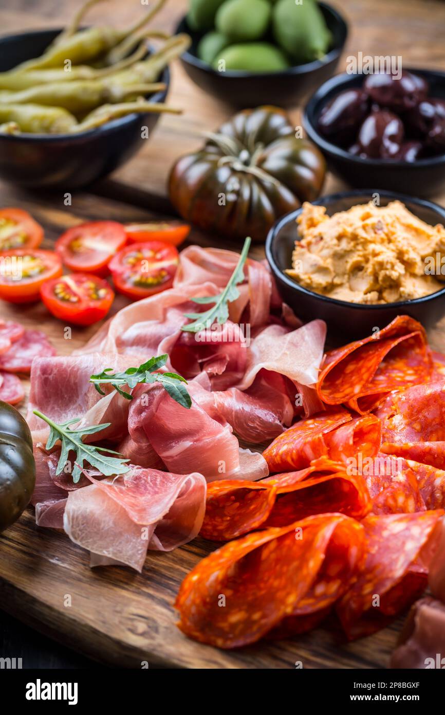 Charcuterie board with prosciutto ham, salami, olives and tapas Stock