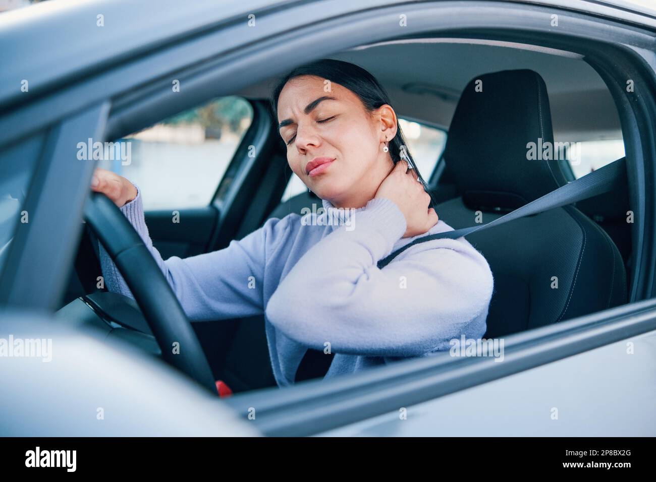 Woman suffering injury after car crash fender bender Stock Photo Alamy