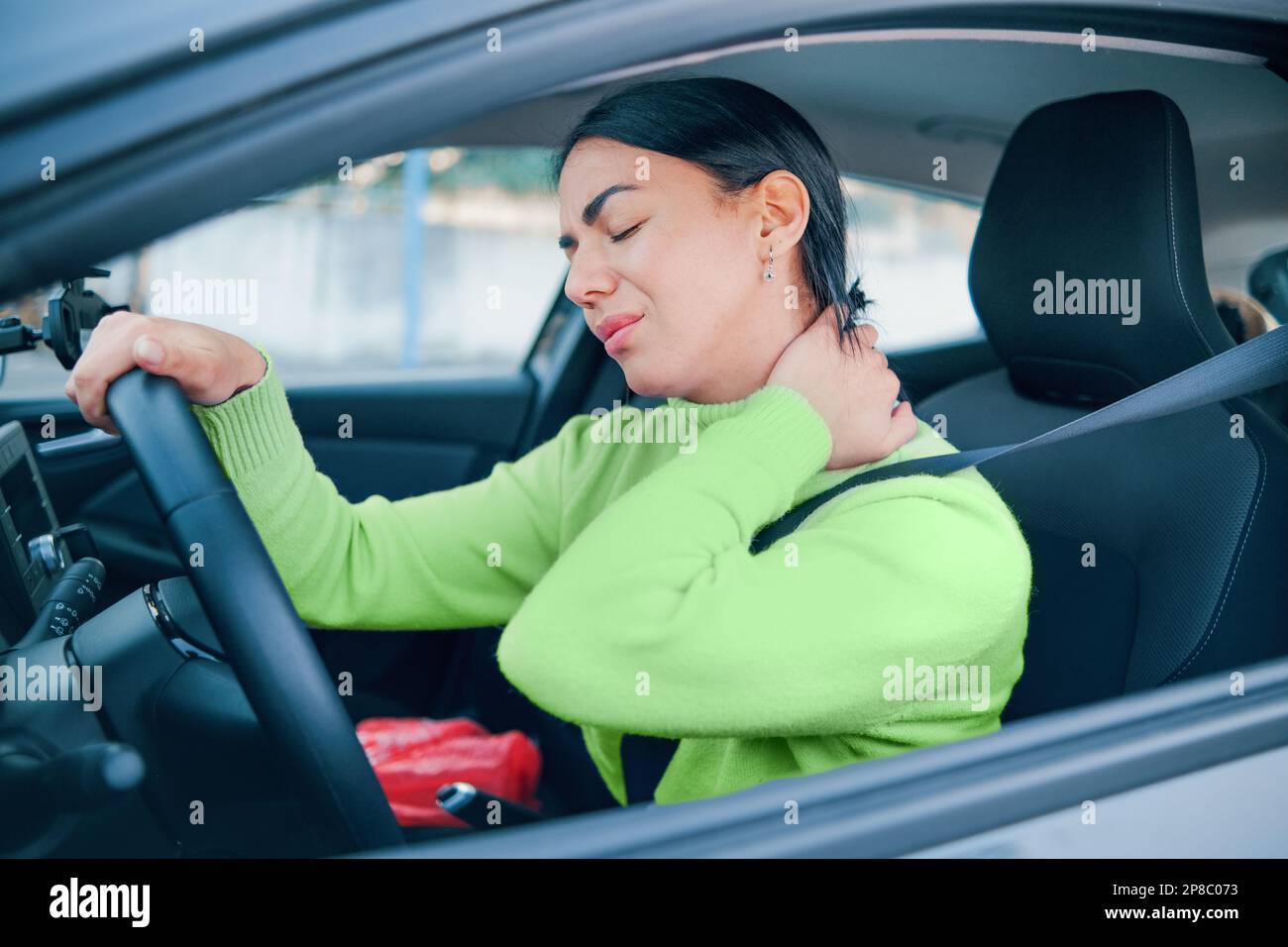 Woman suffering injury after car crash fender bender Stock Photo Alamy