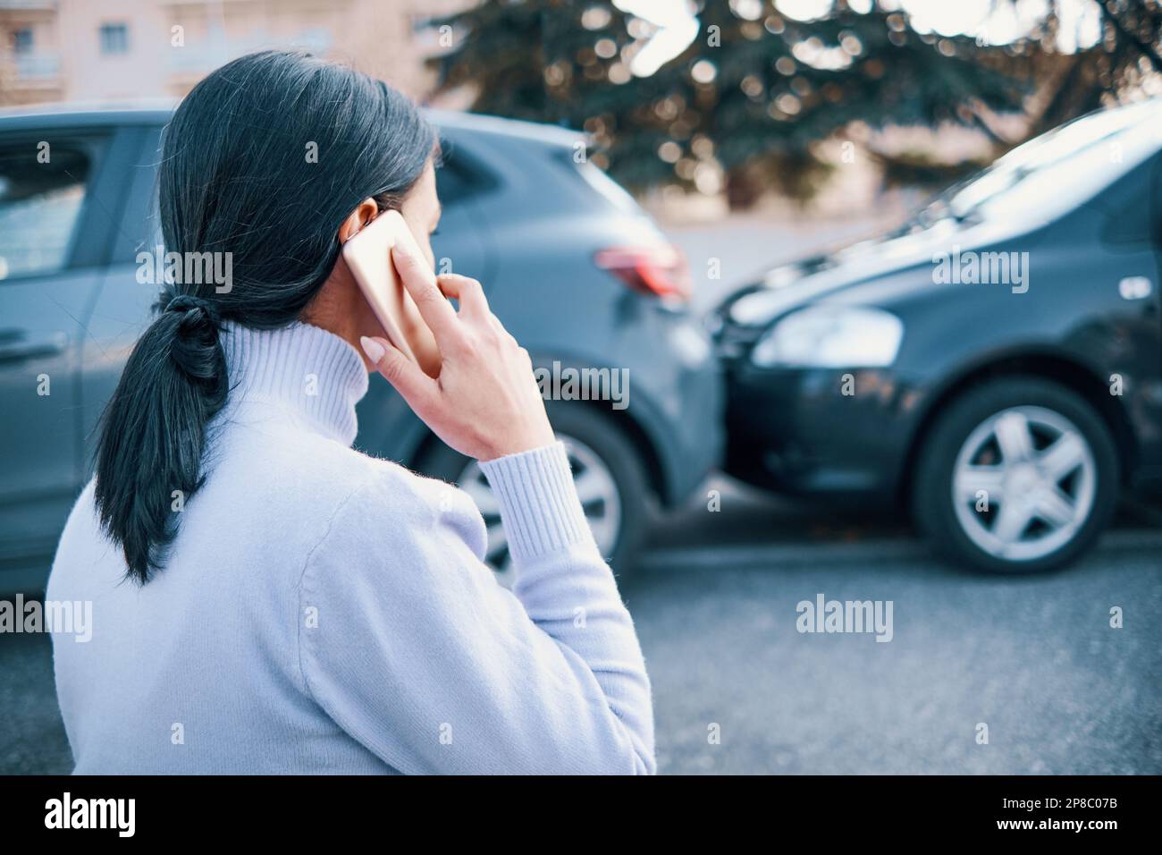 Woman calling insurance after car accident Stock Photo Alamy