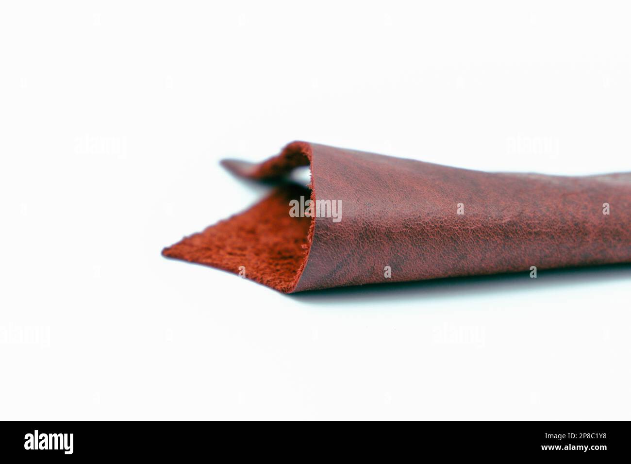 Red leather is folded on a white background Stock Photo
