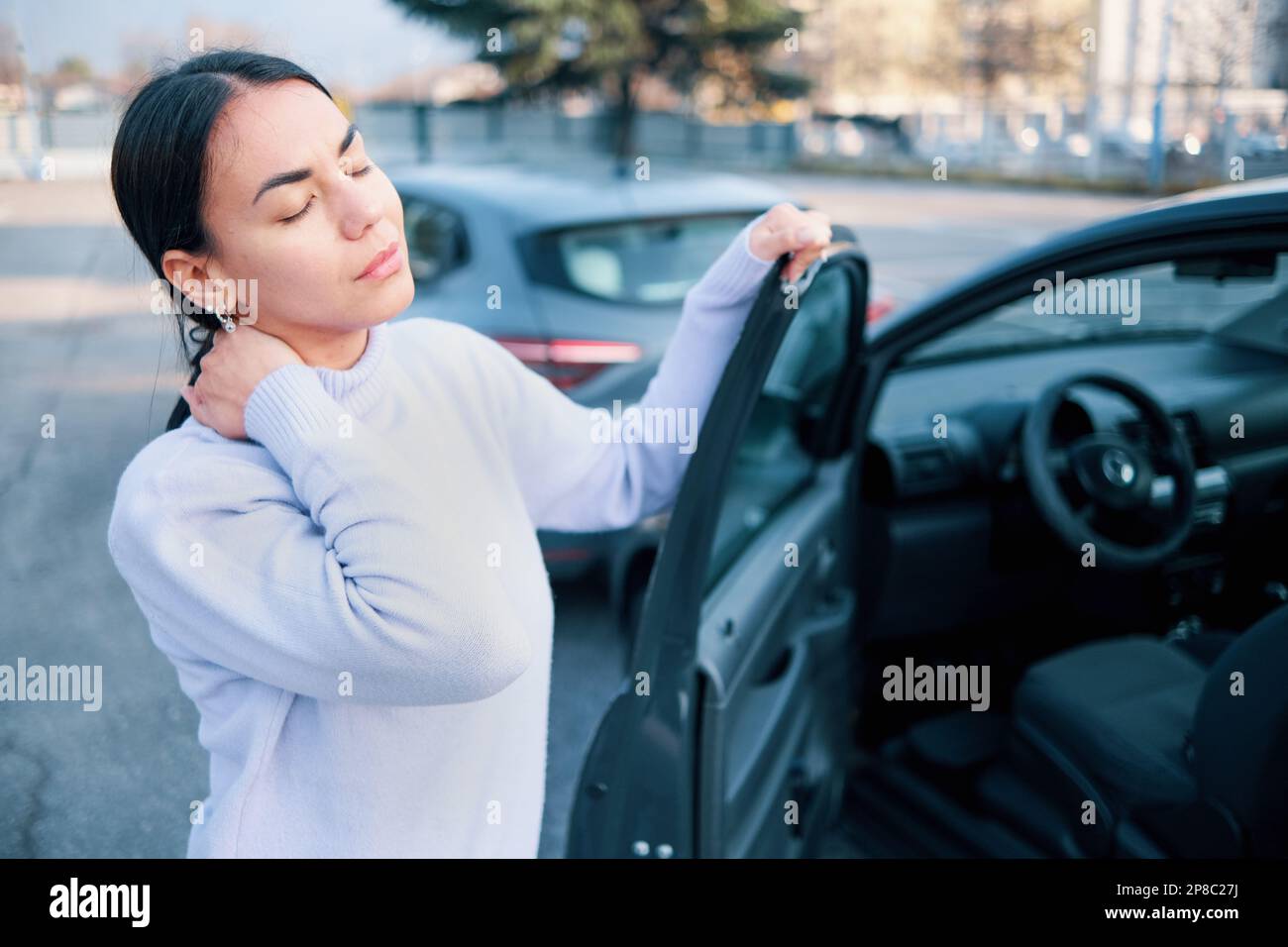 Woman suffering injury after car crash fender bender Stock Photo Alamy