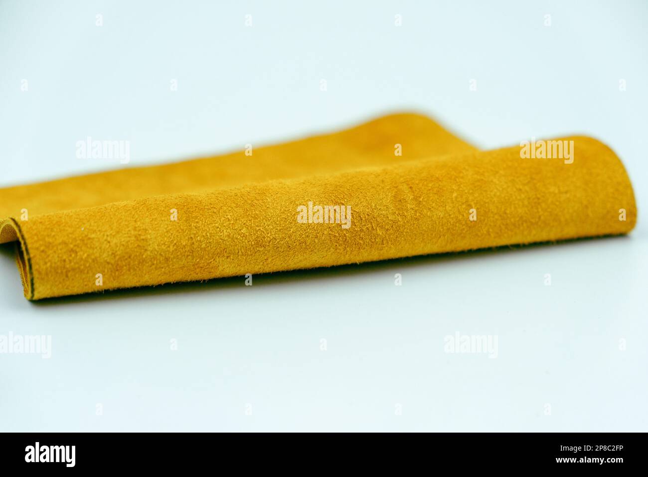 Yellow leather is folded on a white background Stock Photo