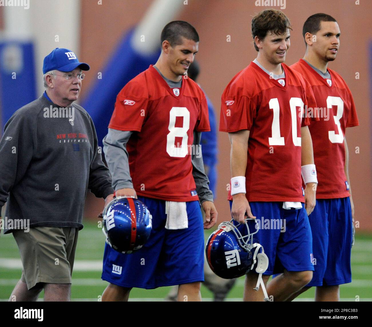 New York Giants quarterbacks David Carr (8), Eli Manning (10) and Andre