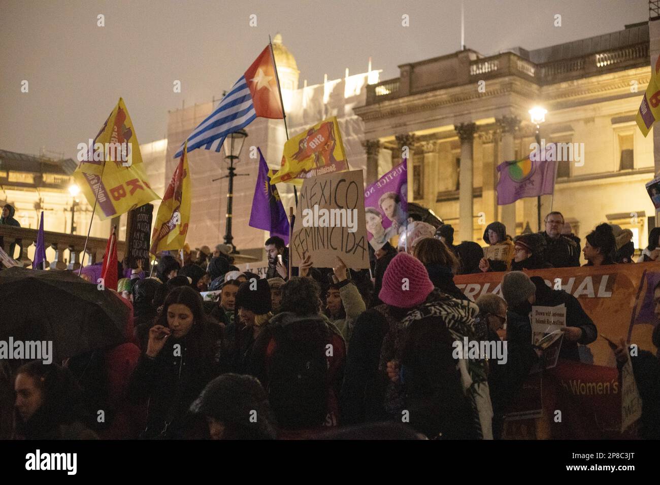 London, UK - 8 March 2023: On a cold and rainy evening, women from various backgrounds, including British, French, Iranian, Turkish, Chinese, Mexican, Afghan, and numerous other nationalities and groups, joined together in Trafalgar Square to mark International Women's Day. Credit: Sinai Noor / Alamy Live News Stock Photo