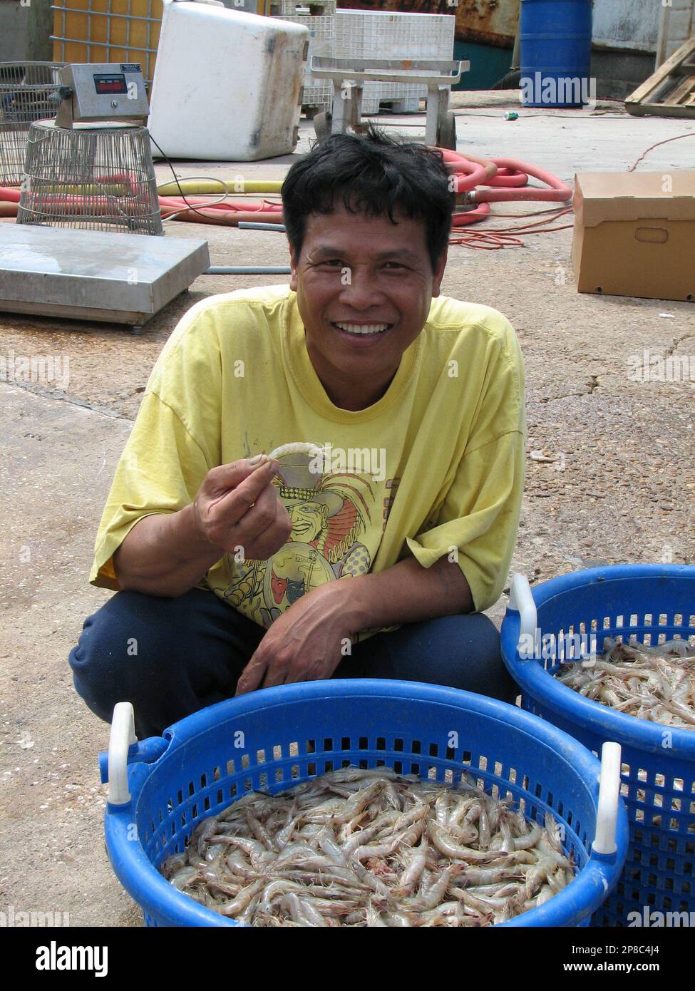 Shrimp fisherman Ho Van Le shows his catch in photo Tuesday, June 9