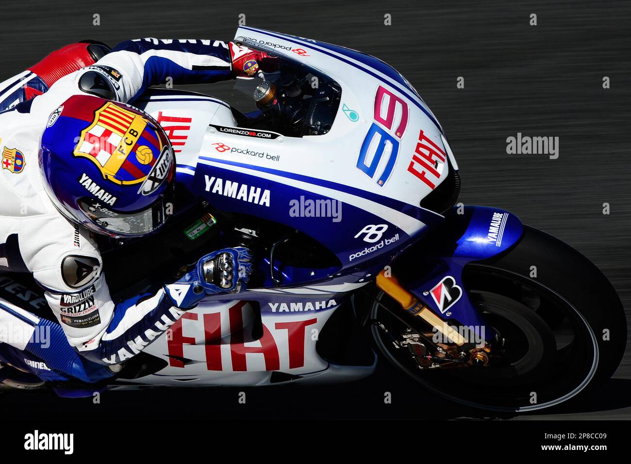MotoGP rider Jorge Lorenzo from Spain drives his Yamaha to get the pole  position ahead of teammate Yamaha's Italian Valentino Rossi during the  practice session of the Catalunya Grand Prix at the
