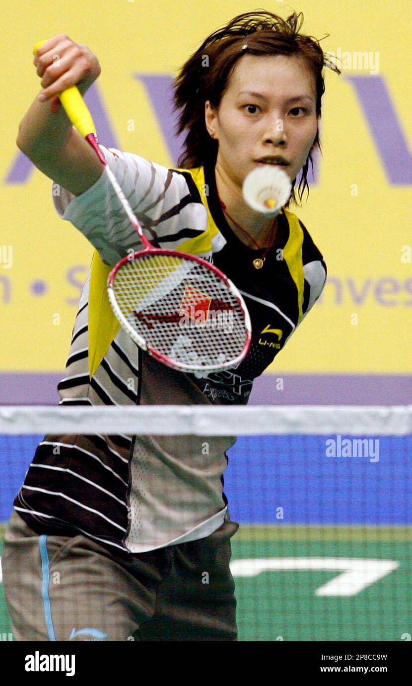 Xie Xingfang of China returns a shot during her semi-final match against compatriot Jiang Yanjiao at the Aviva Singapore Super Series Badminton tournament Saturday, June 13, 2009 in Singapore. Xie won the match 17-21, 21-10, 21-19. (AP Photo/Wong Maye-E) Stock Photo