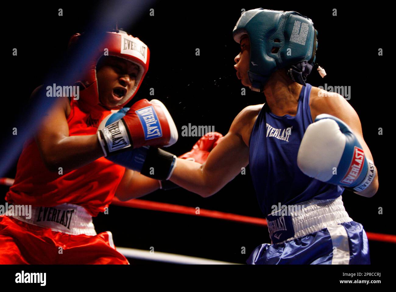Dierdre Rhodes, left, takes a punch from Melissa Roberts during their ...