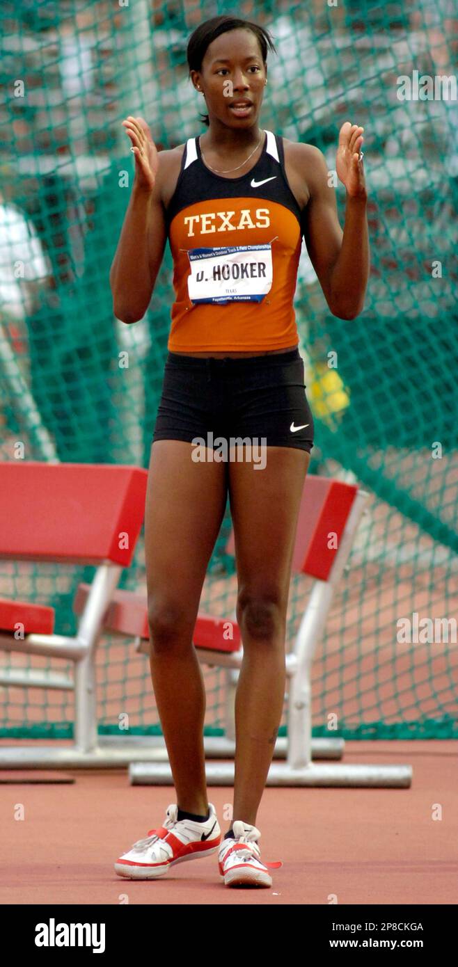 Texas' Destinee Hooker gets instructions from her coach, not shown
