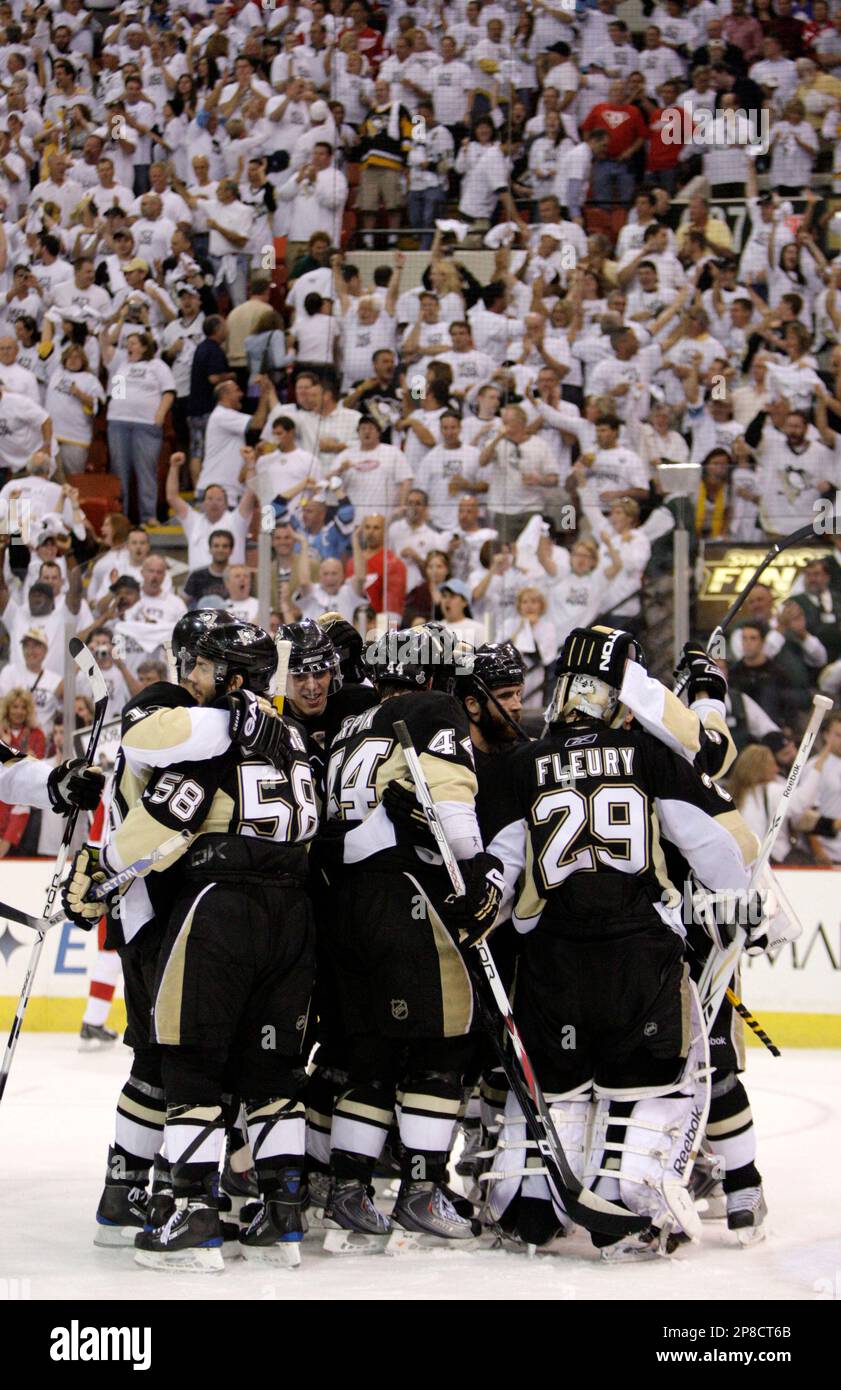 Pittsburgh Penguins players celebrate after beating the Detroit Red