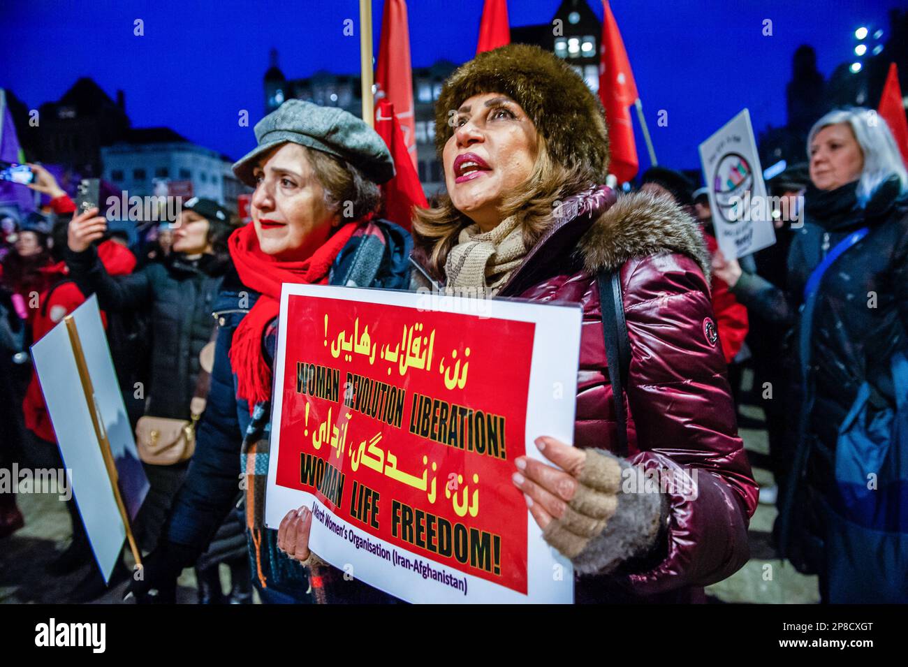 Amsterdam, Netherlands. 08th Mar, 2023. Iranian women are seen shouting slogans in support of Iranian women. Around two hundred people gathered at the Dam Square and from there they walked in procession to stand up against violence and femicide, ask for better salaries, against dictatorships, to fight for equal rights for women around the world in celebration of International Women's Day. Credit: SOPA Images Limited/Alamy Live News Stock Photo