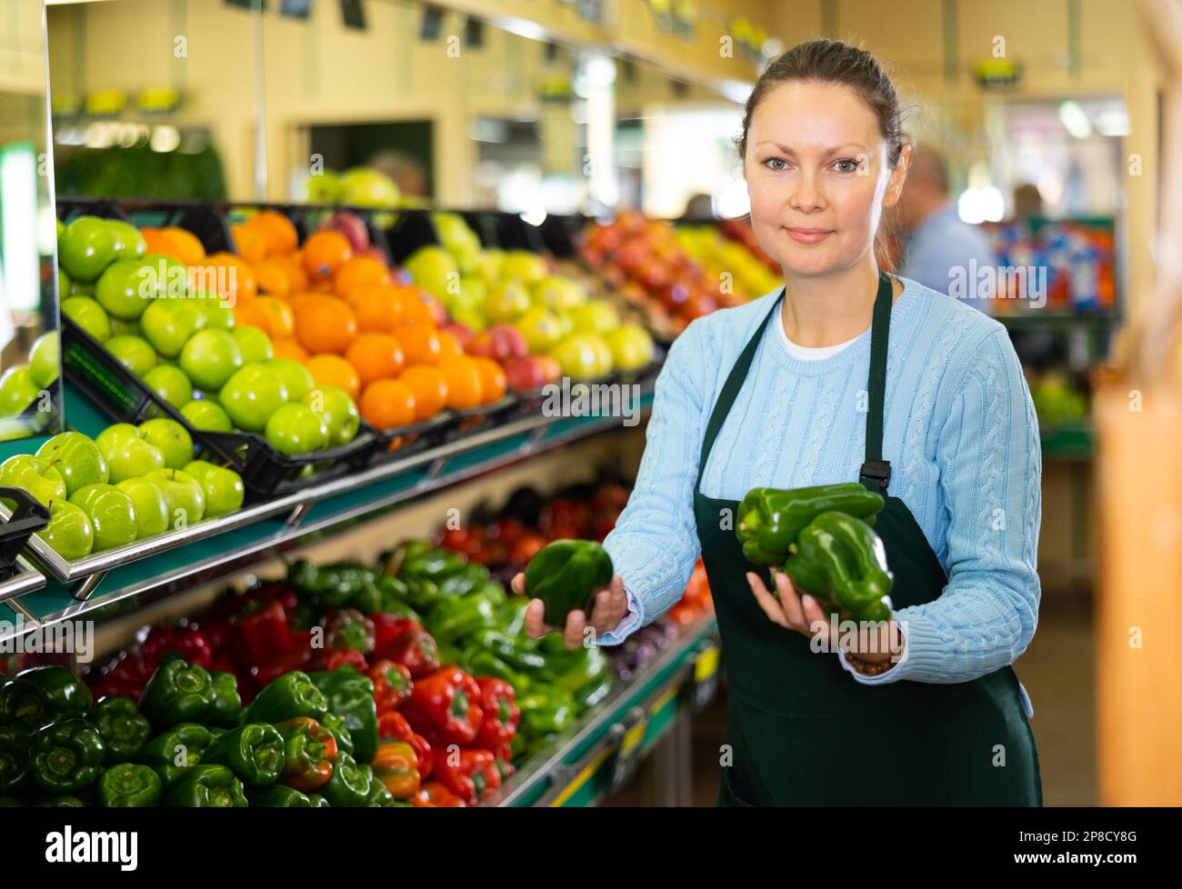 female seller selling peppers Stock Photo Alamy