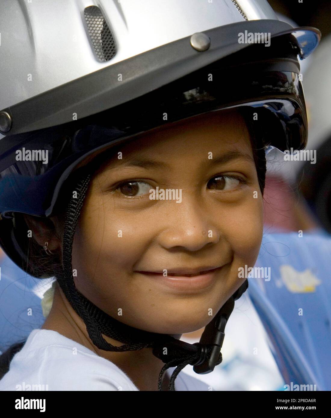 bike helmet phnom penh Demon Podium Full Face Bicycle Helmet- Tan/Black LARGE / Tan/Black / BRAIN TEASER AUDIO at a bike A Cambodian school girl smiles