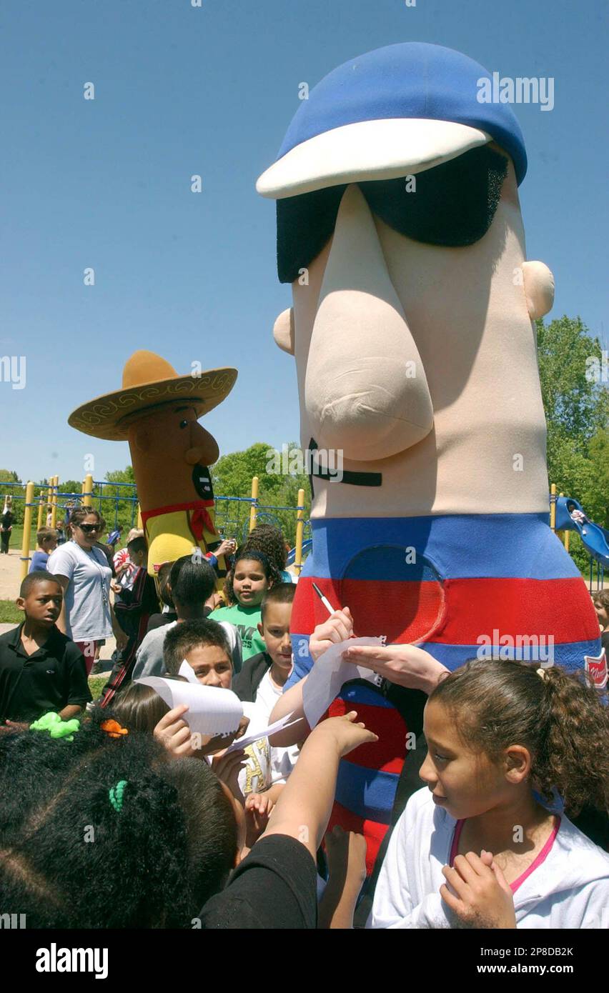 Stosh, the Polish Sausage, signs autographs, when the Milwaukee Brewers'  baseball team's Racing Sausages mascots came to Dr. Jones Elementary School  in Racine, Wis. Thursday June 4, 2009 as part of the