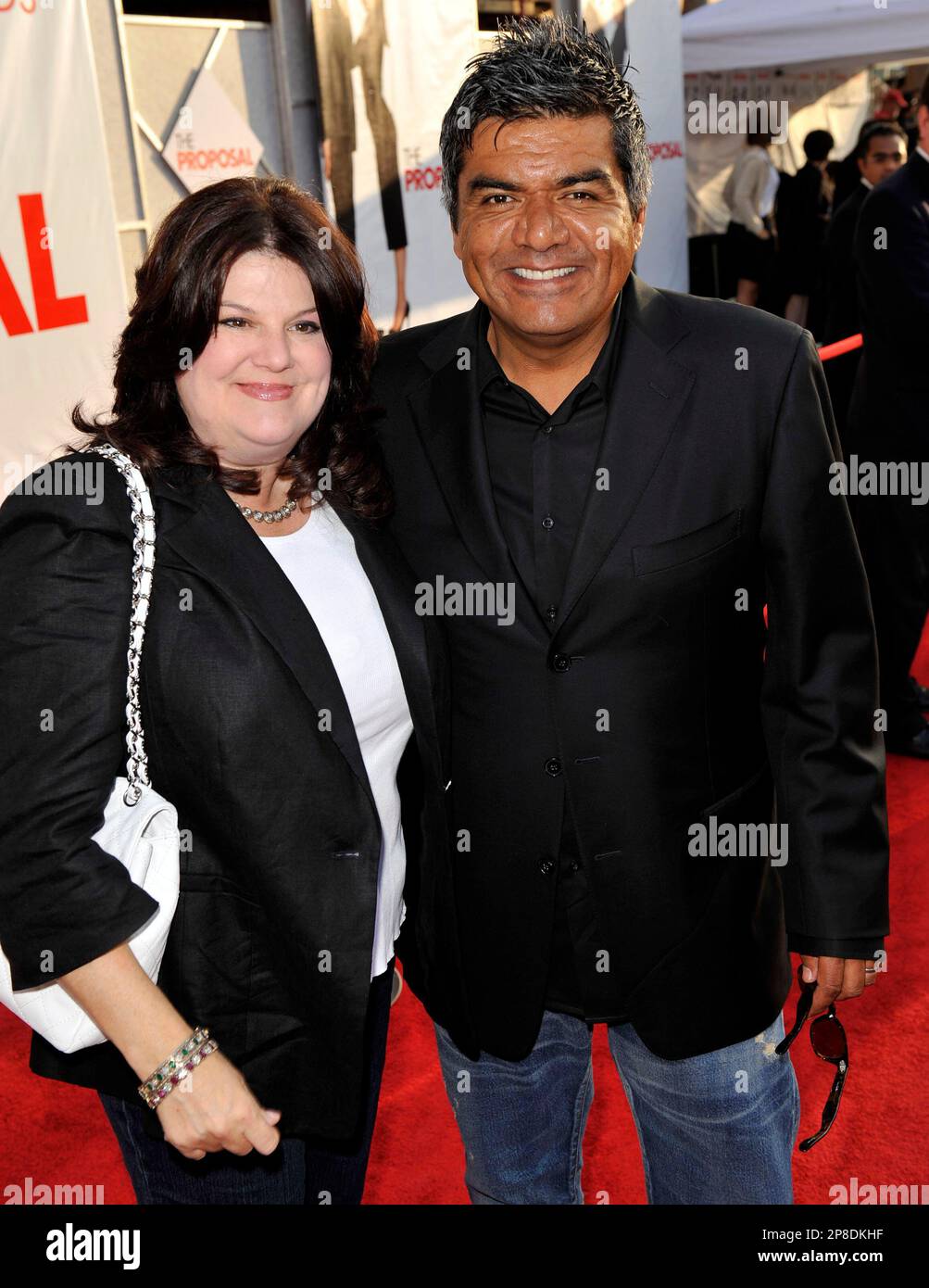 Lopez, right, and wife Ann Serrano arrive at the premiere of "The Proposal" on Monday