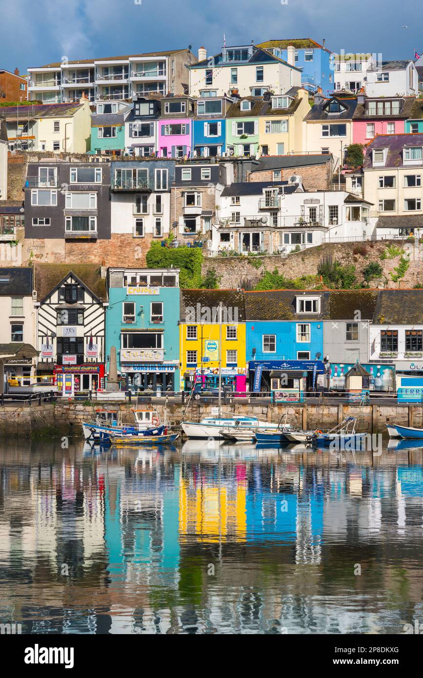 Brixham UK, view of colourful waterfront property in the harbour at Brixham, Torbay, Devon, south west England, UK Stock Photo