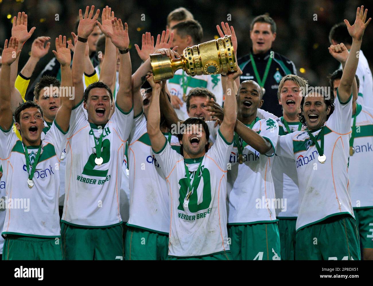 Bremen's Diego raises the cup during the winning ceremony for German Soccer  Cup Final, the DFB Pokal, at the Olympic stadium in Berlin, Germany,  Saturday, May 30, 2009. Werder Bremen defeated Bayer