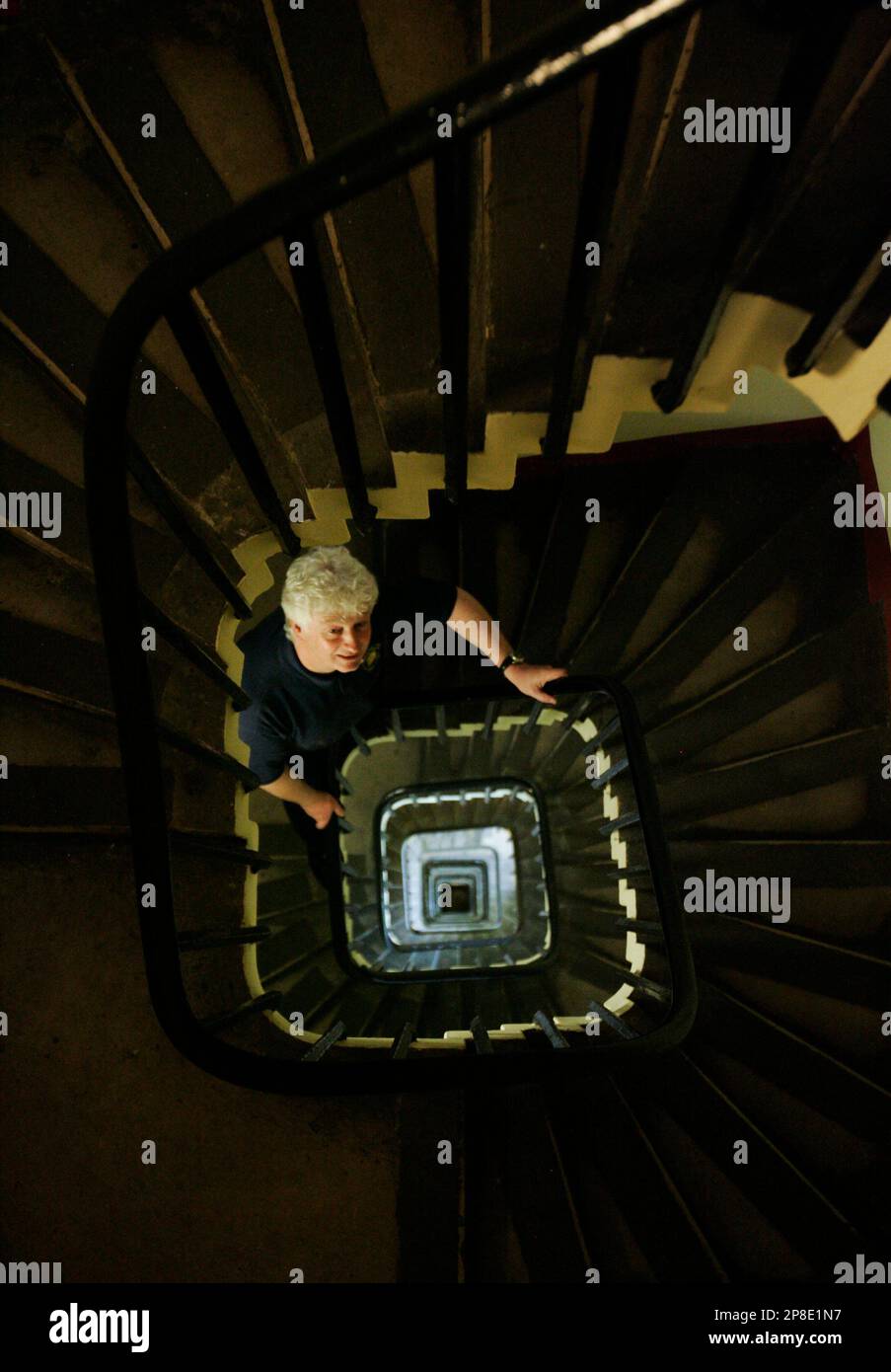 Clock maker Paul Roberson, poses in the 334-step winding limestone ...