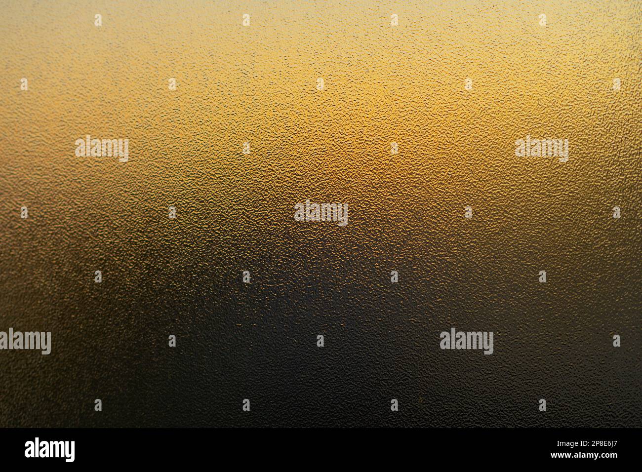Golden sunset shining through frosted glass Stock Photo Alamy