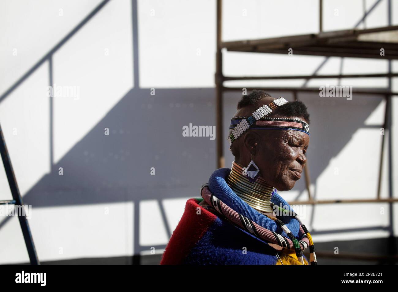 Ndebele Geometry World famous Ndebele artist Esther Mahlangu walks past a mural she and ...