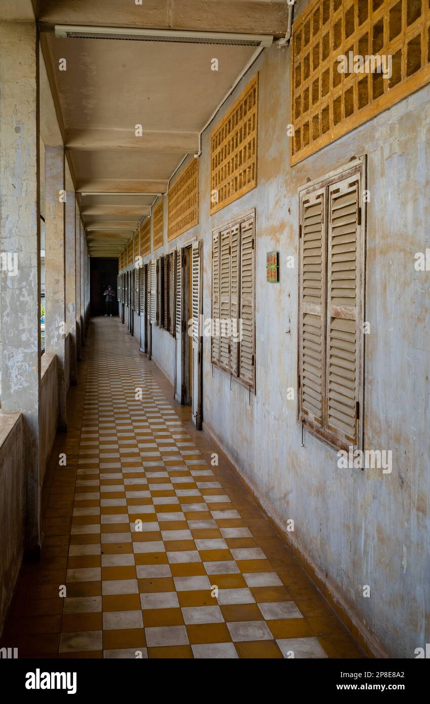 A corridor past former classrooms in the notorious Tuol Sleng S-21 torture and genocide prison museum in Phnom Penh, Cambodia. More than 18,000 peopl Stock Photo