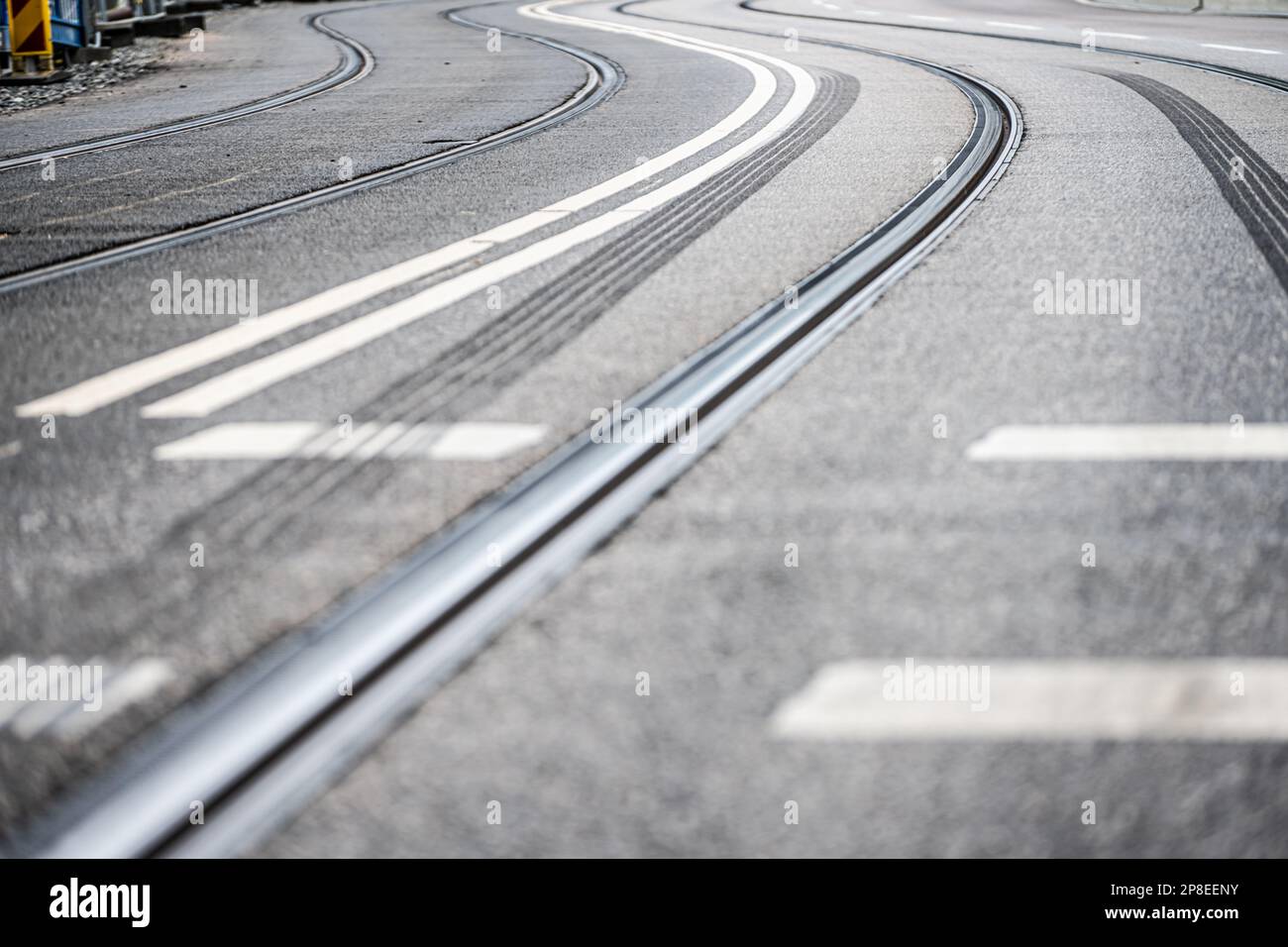 Tram track curve on asphalt road Stock Photo - Alamy