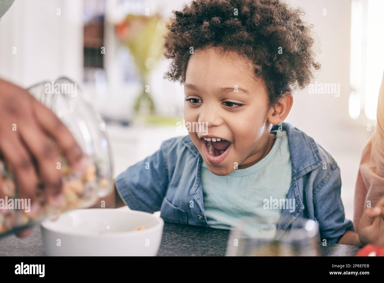 Excited, happy and child ready for breakfast cereal in the morning ...