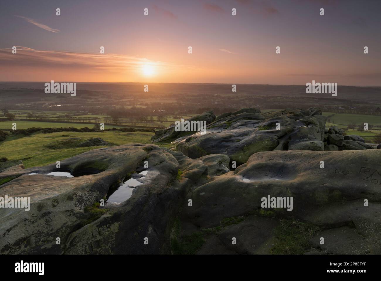 Sunrise at Almscliffe Crag, in the Lower Wharfe Valley, close to the village of North Rigton, North Yorkshire Stock Photo